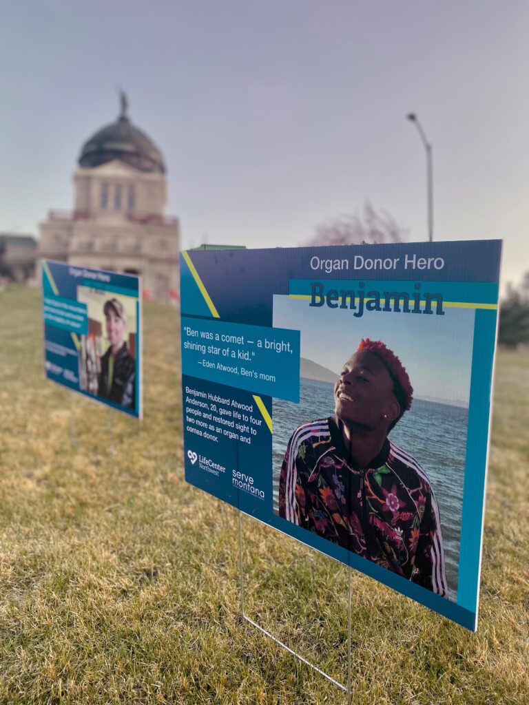 Ben Anderson, an organ donor, has his photo displayed on a yard sign outside the capitol building in Helena, Montana.